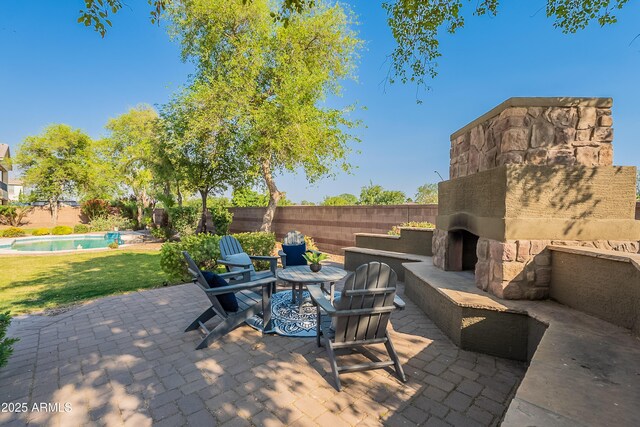 2735 E Flower Ct, Gilbert, AZ 85298 - view of patio with an outdoor stone fireplace and fence