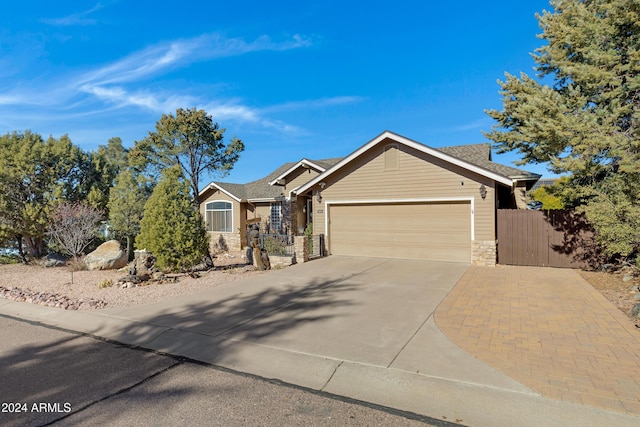 ranch-style home featuring a garage