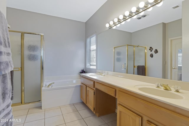 bathroom with tile patterned flooring, shower with separate bathtub, and vanity