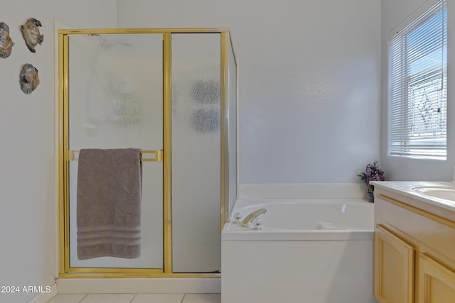 bathroom with tile patterned floors, plus walk in shower, and vanity