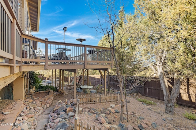 view of yard with a wooden deck