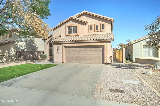 mediterranean / spanish-style house with a garage, fence, a tile roof, driveway, and stucco siding