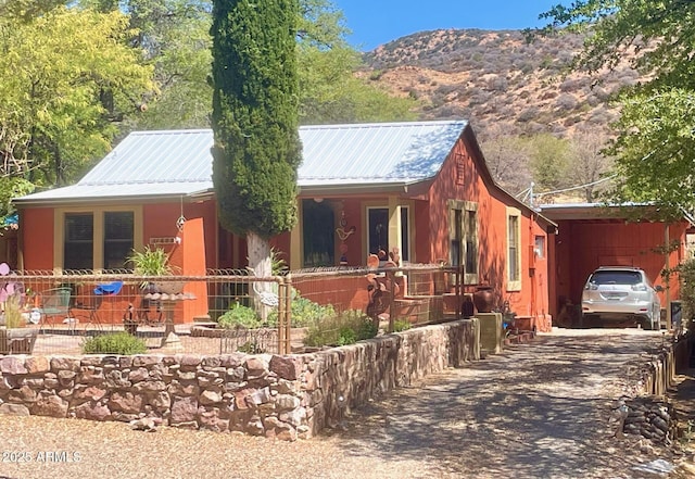 1608 W W Blvd, Bisbee, AZ 85603 - view of front of home featuring driveway, metal roof, a mountain view, and a carport