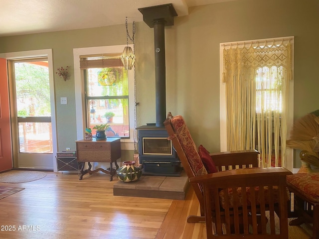 1608 W W Blvd, Bisbee, AZ 85603 - living area with a wood stove, wood-type flooring, and plenty of natural light