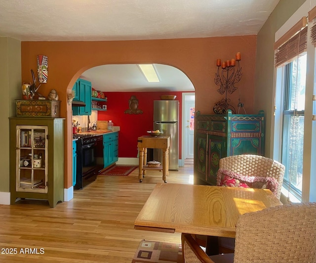 1608 W W Blvd, Bisbee, AZ 85603 - dining area with arched walkways and light wood-type flooring