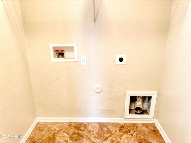 clothes washing area with hookup for an electric dryer, tile patterned floors, and hookup for a washing machine