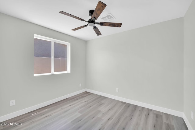 5236 S 19th Ave, Phoenix, AZ 85041 - spare room with wood finished floors, ceiling fan, and baseboards