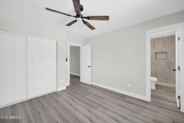 5236 S 19th Ave, Phoenix, AZ 85041 - unfurnished bedroom featuring wood finished floors, baseboards, and a closet