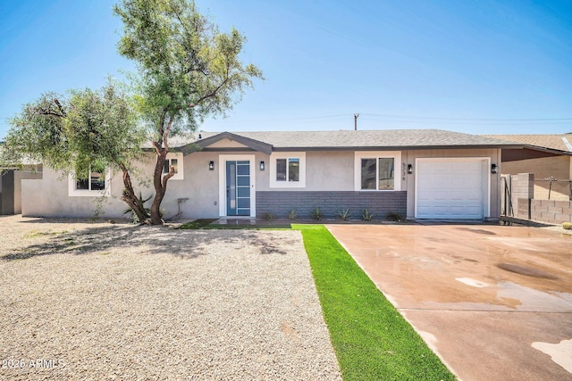 5236 S 19th Ave, Phoenix, AZ 85041 - ranch-style house with brick siding, an attached garage, driveway, and stucco siding