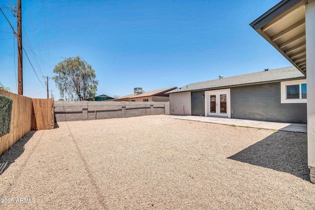 5236 S 19th Ave, Phoenix, AZ 85041 - fenced backyard featuring french doors and a patio area