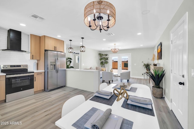 5236 S 19th Ave, Phoenix, AZ 85041 - living area featuring light wood finished floors, a chandelier, recessed lighting, baseboards, and french doors