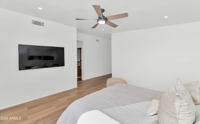 bedroom featuring a ceiling fan, recessed lighting, wood finished floors, and visible vents