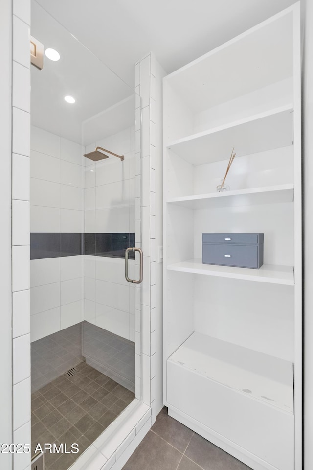 bathroom with tile patterned floors, recessed lighting, and a stall shower