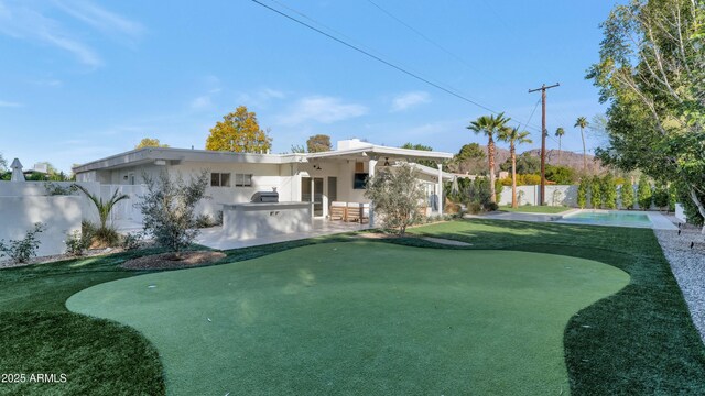 exterior space with a patio and a fenced backyard