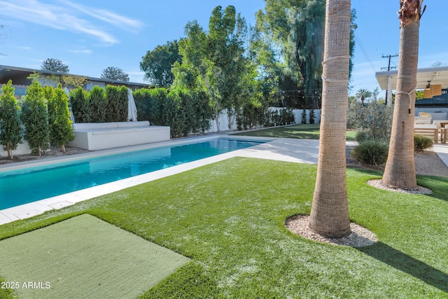 view of pool featuring a lawn, a fenced backyard, and a fenced in pool