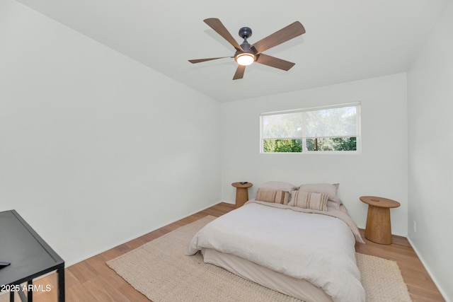 bedroom featuring light wood finished floors and ceiling fan