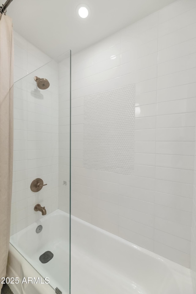 bathroom featuring  shower combination