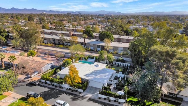 birds eye view of property with a mountain view