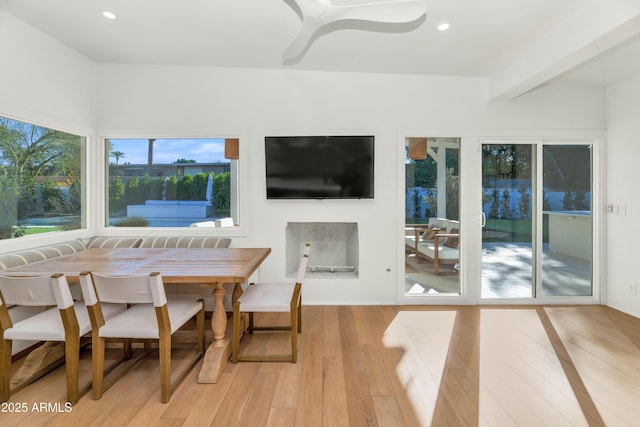 dining space featuring beamed ceiling, breakfast area, recessed lighting, light wood-style floors, and ceiling fan