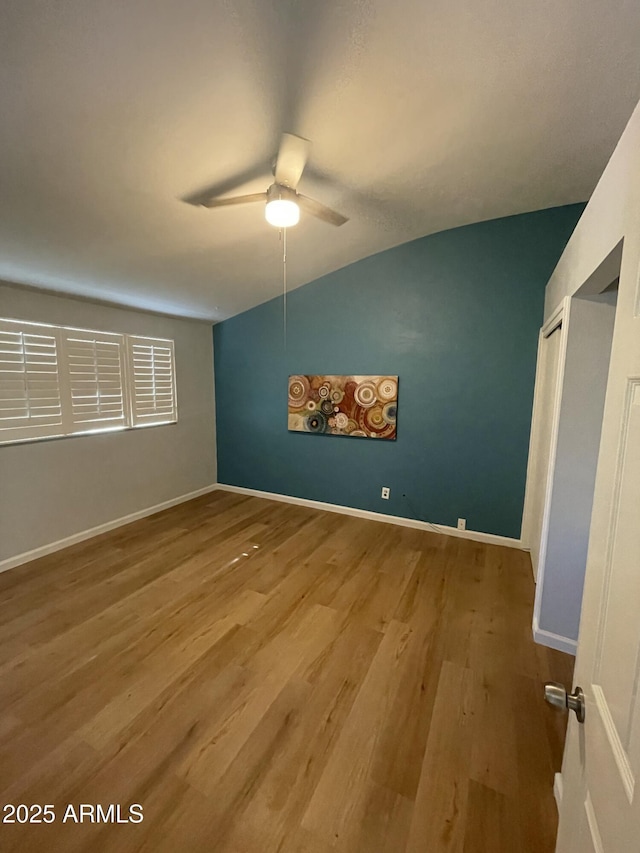 unfurnished bedroom with ceiling fan and light hardwood / wood-style floors