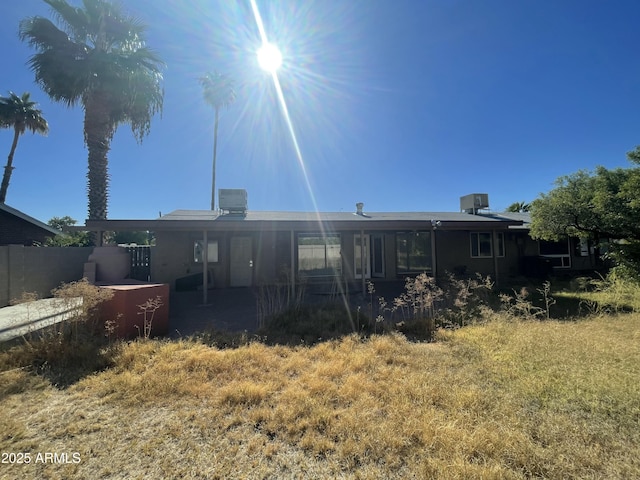 back of property featuring central air condition unit