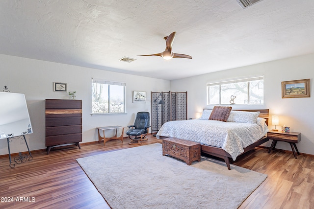 bedroom featuring dark hardwood / wood-style flooring and ceiling fan