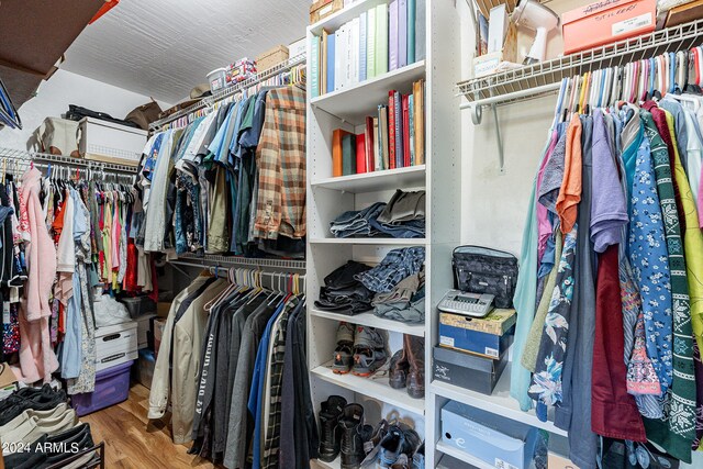 spacious closet featuring hardwood / wood-style flooring