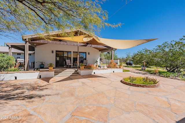 back of house featuring a patio area