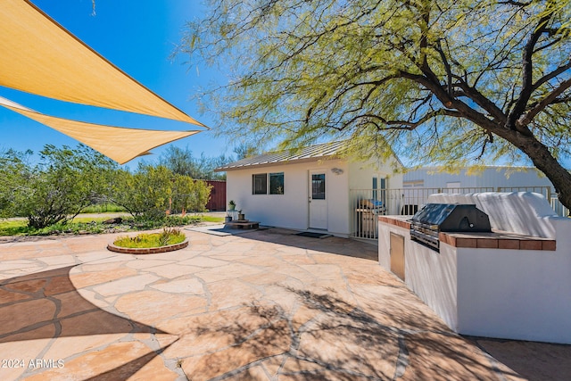 view of patio / terrace featuring exterior kitchen