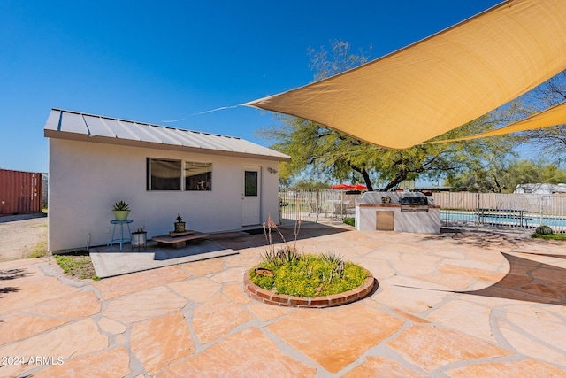 back of house with a patio