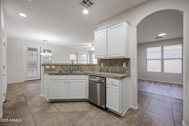 45633 W Mountain View Rd, Maricopa, AZ 85139 - kitchen featuring visible vents, stainless steel dishwasher, a sink, light tile patterned floors, and tile counters