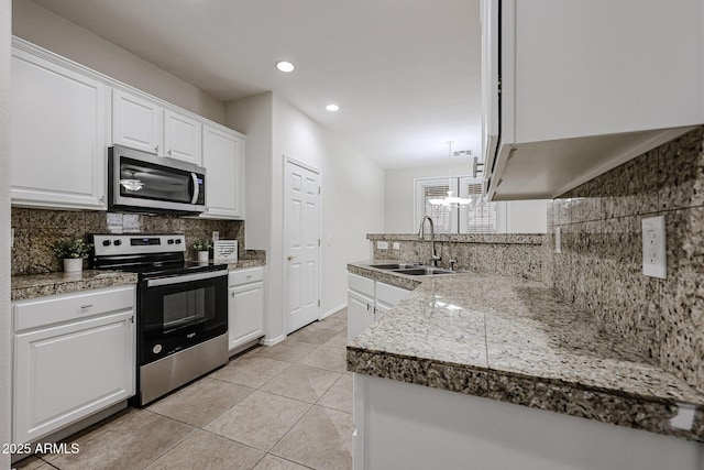 45633 W Mountain View Rd, Maricopa, AZ 85139 - kitchen with backsplash, stainless steel appliances, tile countertops, and a sink