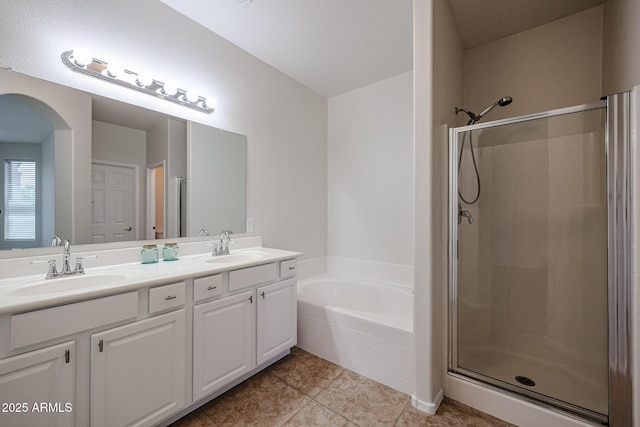45633 W Mountain View Rd, Maricopa, AZ 85139 - full bathroom featuring a sink, tile patterned floors, a shower stall, and a bath