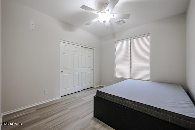 45633 W Mountain View Rd, Maricopa, AZ 85139 - unfurnished bedroom with light wood-style floors, baseboards, a closet, and visible vents