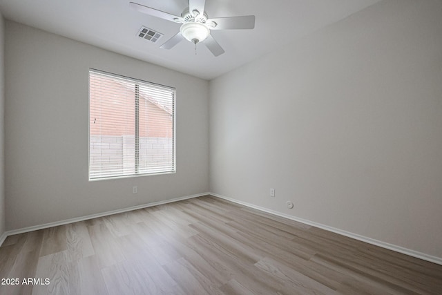 45633 W Mountain View Rd, Maricopa, AZ 85139 - unfurnished room featuring visible vents, a ceiling fan, baseboards, and wood finished floors