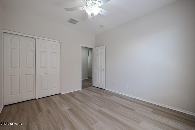 45633 W Mountain View Rd, Maricopa, AZ 85139 - unfurnished bedroom with visible vents, baseboards, a closet, and light wood-type flooring
