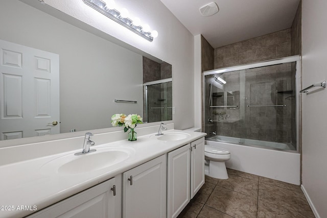 45633 W Mountain View Rd, Maricopa, AZ 85139 - full bath featuring double vanity, a sink, bath / shower combo with glass door, and toilet