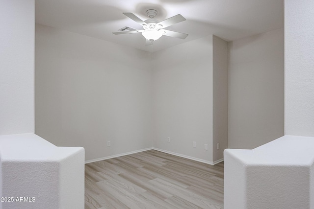 45633 W Mountain View Rd, Maricopa, AZ 85139 - unfurnished room with baseboards, ceiling fan, visible vents, and light wood-style flooring