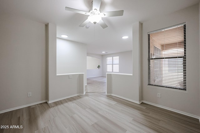 45633 W Mountain View Rd, Maricopa, AZ 85139 - unfurnished room with baseboards, recessed lighting, ceiling fan, and wood finished floors