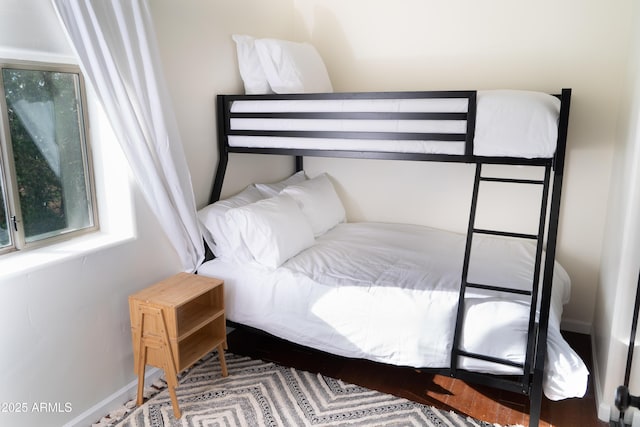 bedroom featuring baseboards