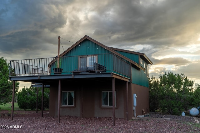 back of house featuring a wooden deck