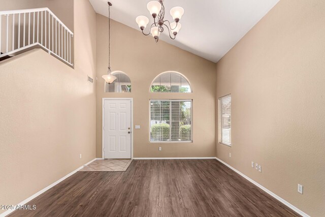 4426 E Coyote Wash Dr, Cave Creek, AZ 85331 - entryway with wood finished floors, a chandelier, baseboards, and high vaulted ceiling