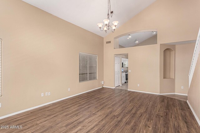 4426 E Coyote Wash Dr, Cave Creek, AZ 85331 - spare room featuring dark wood finished floors, a chandelier, baseboards, and high vaulted ceiling