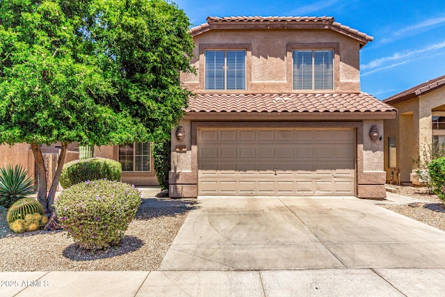 4426 E Coyote Wash Dr, Cave Creek, AZ 85331 - mediterranean / spanish house with driveway, an attached garage, a tile roof, and stucco siding