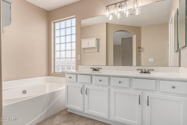 4426 E Coyote Wash Dr, Cave Creek, AZ 85331 - full bath with double vanity, a garden tub, tile patterned flooring, and a chandelier