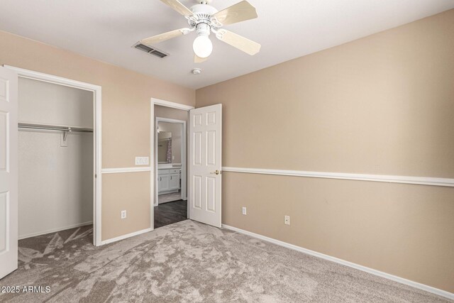 4426 E Coyote Wash Dr, Cave Creek, AZ 85331 - unfurnished bedroom featuring carpet flooring, a closet, baseboards, and a ceiling fan