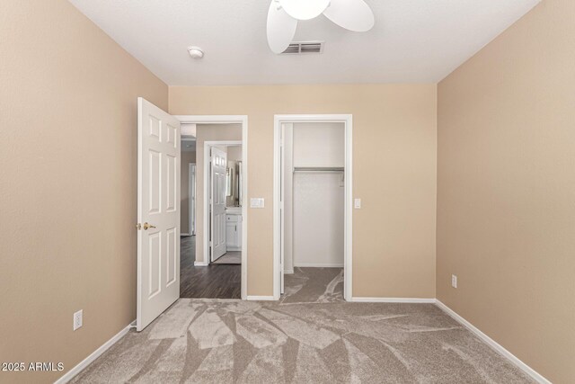 4426 E Coyote Wash Dr, Cave Creek, AZ 85331 - unfurnished bedroom featuring carpet floors, a walk in closet, baseboards, and a closet