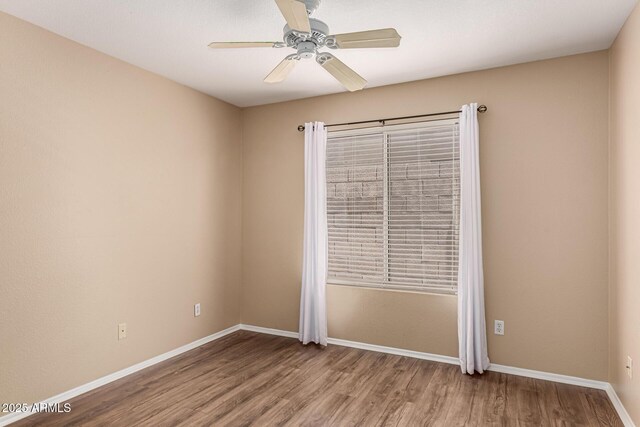4426 E Coyote Wash Dr, Cave Creek, AZ 85331 - spare room with wood finished floors, baseboards, and ceiling fan