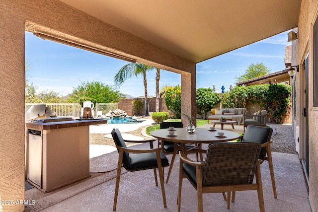 4426 E Coyote Wash Dr, Cave Creek, AZ 85331 - fenced backyard with a patio, outdoor dining area, and an outdoor kitchen