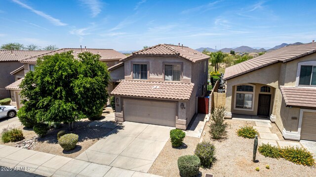 4426 E Coyote Wash Dr, Cave Creek, AZ 85331 - view of front facade featuring stucco siding, concrete driveway, a tile roof, and a garage